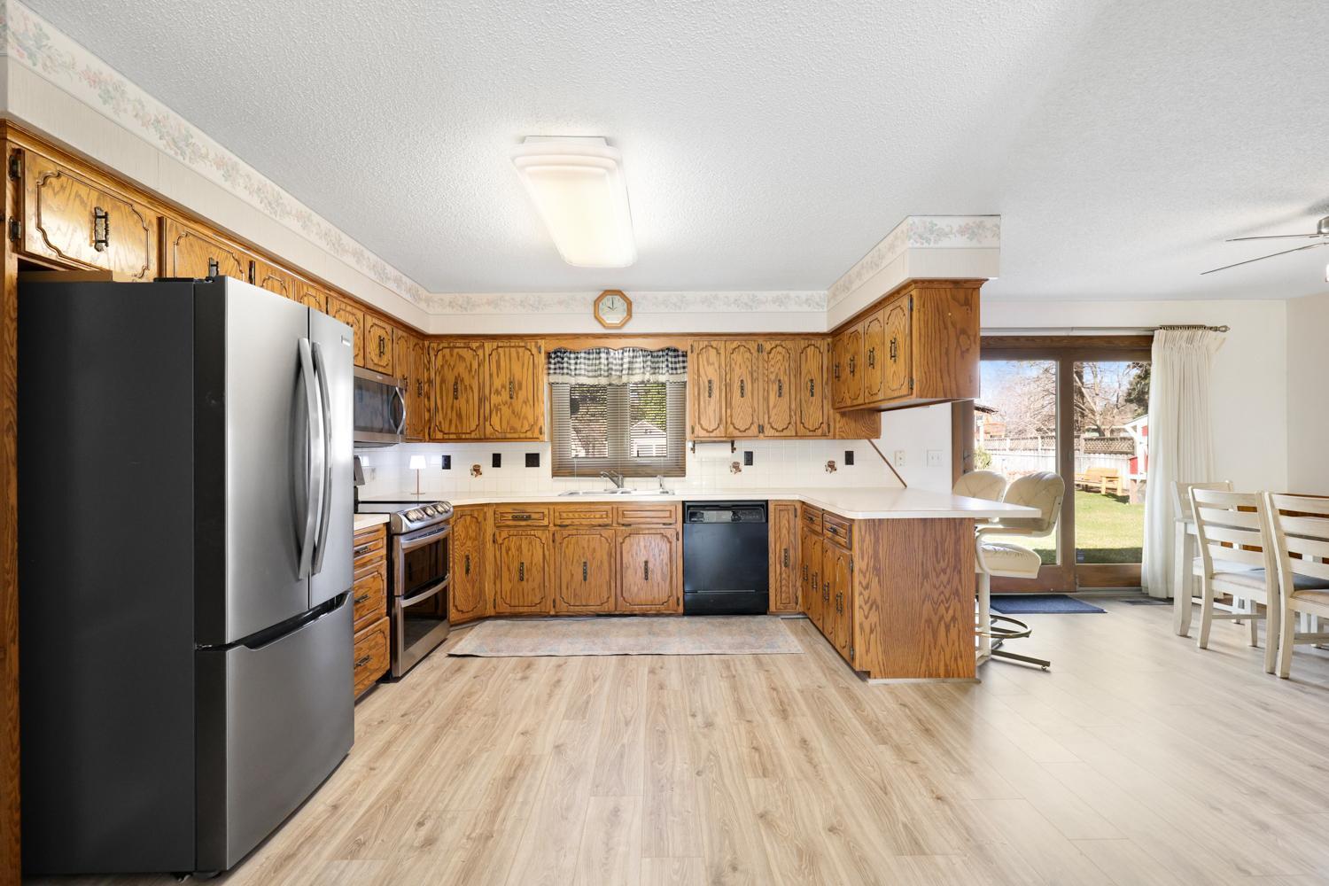Bright, functional kitchen with abundant cabinetry and easy flow into the dining space perfect for everyday living and gathering.