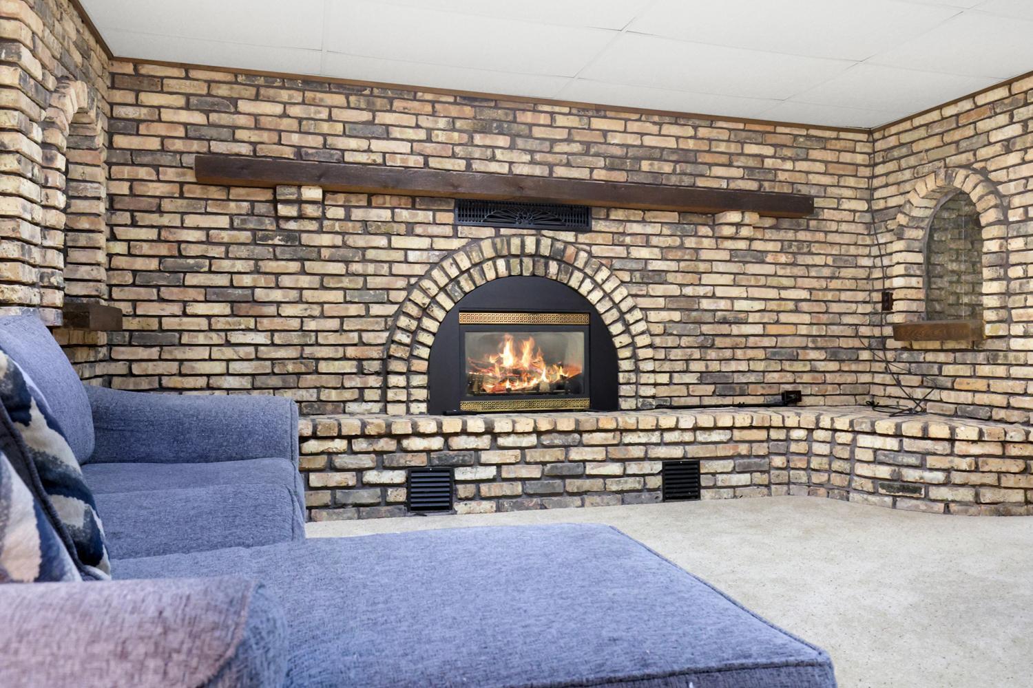 Warm, inviting, and full of character—this fireplace is the heart of the home.