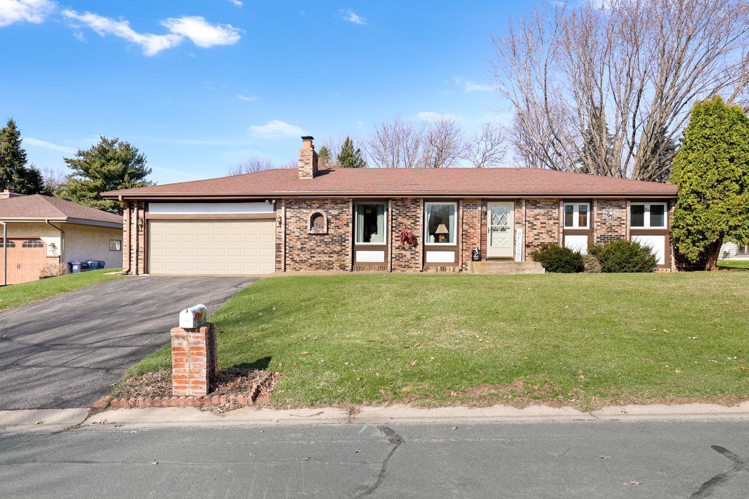 extended driveway and attached garage.