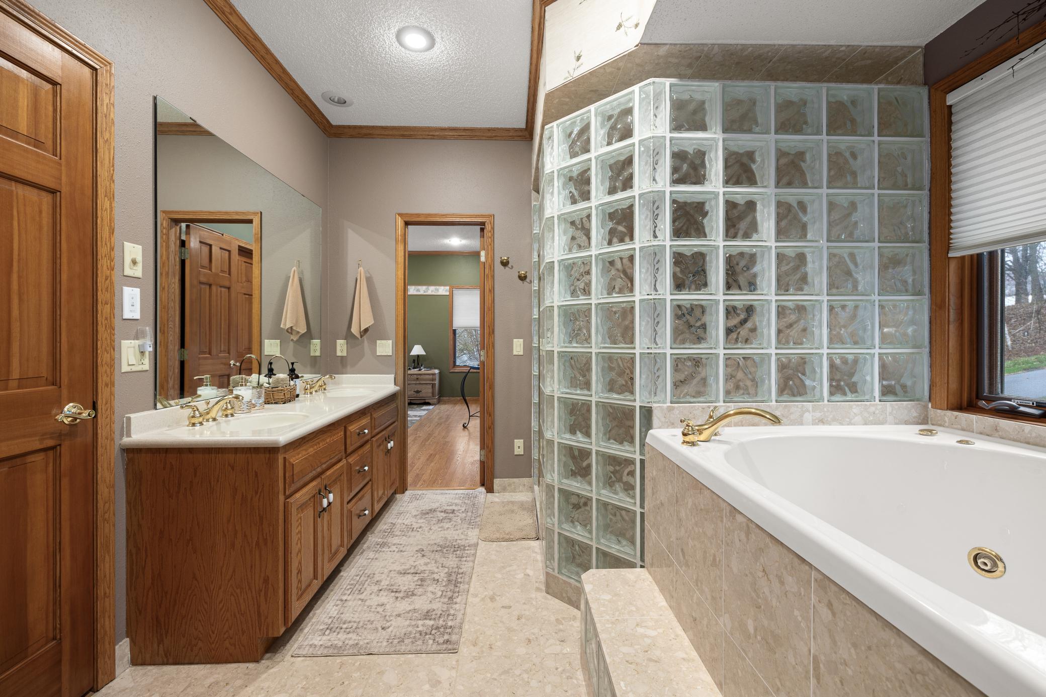 Ensuite Bathroom with Japanese Soaking Tub & Glass Block Walk-in Shower