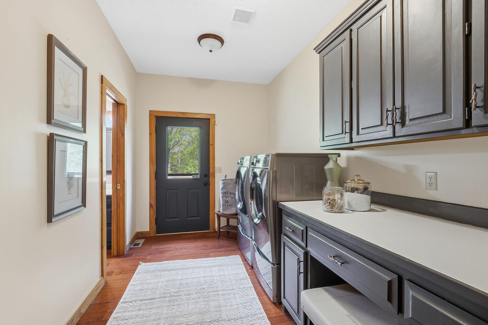 A thoughtfully designed laundry area with direct access to outdoors and bathroom; blending everyday functionality with seamless flow for busy households.