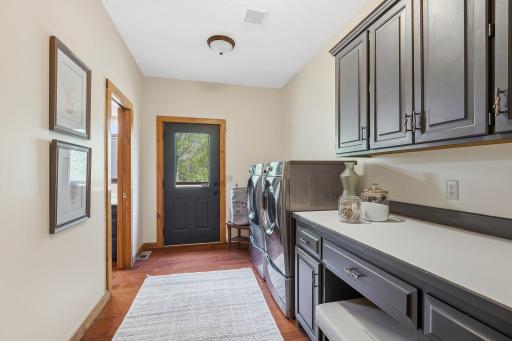 A thoughtfully designed laundry area with direct access to outdoors and bathroom; blending everyday functionality with seamless flow for busy households.