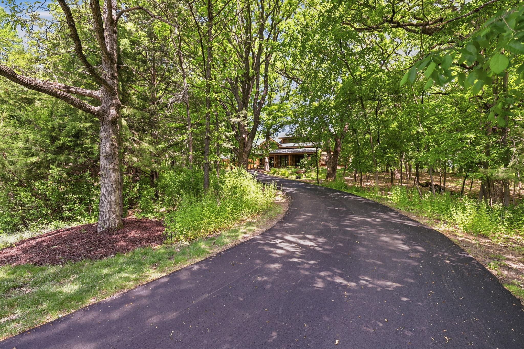 Private, tree-lined cedar deck creates the perfect setting for outdoor dining, entertaining, or simply enjoying the peaceful natural surroundings.