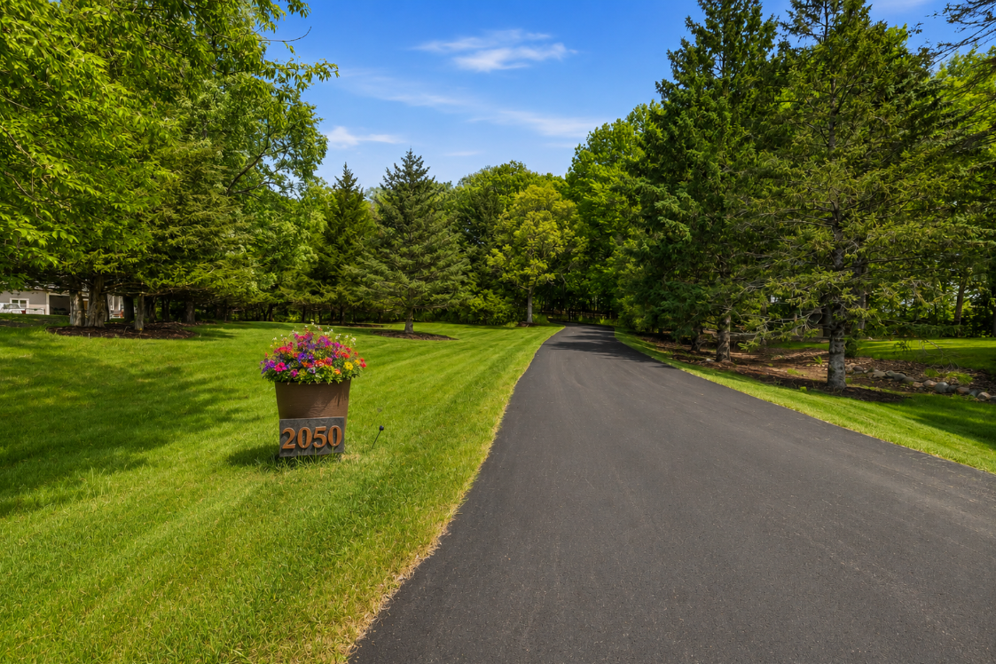 Private, tree-lined cedar deck creates the perfect setting for outdoor dining, entertaining, or simply enjoying the peaceful natural surroundings.