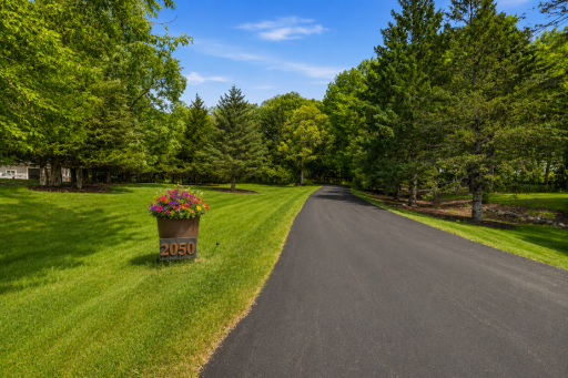 Private, tree-lined cedar deck creates the perfect setting for outdoor dining, entertaining, or simply enjoying the peaceful natural surroundings.