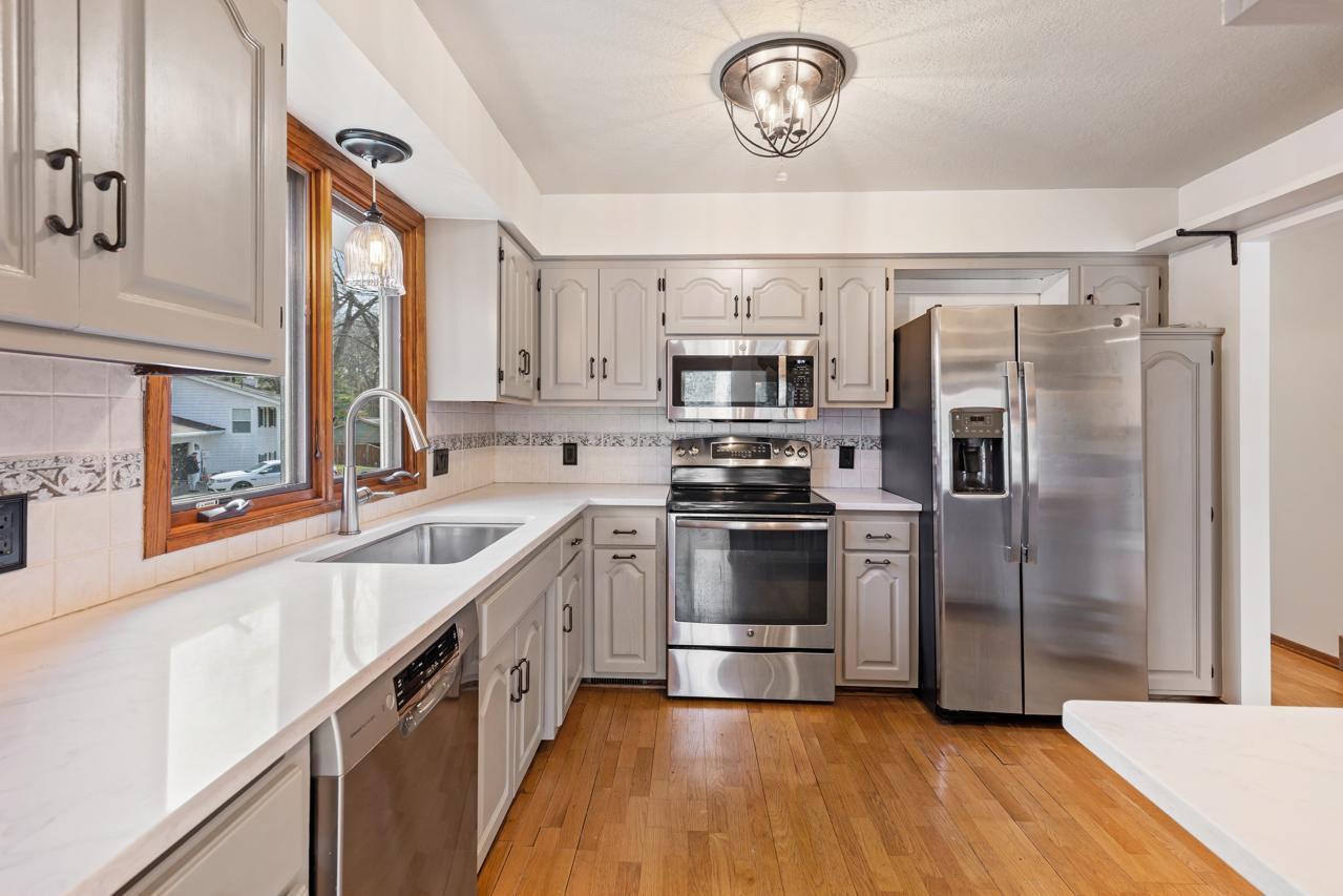 Updated kitchen with stainless steel appliances and new quartz countertops (2025).