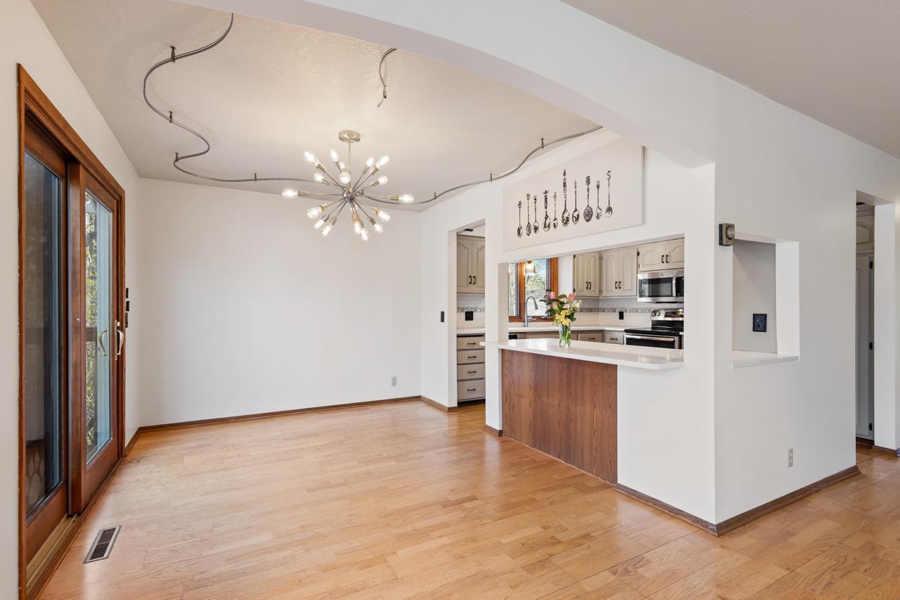 Openings to the kitchen keep area light and bright.
