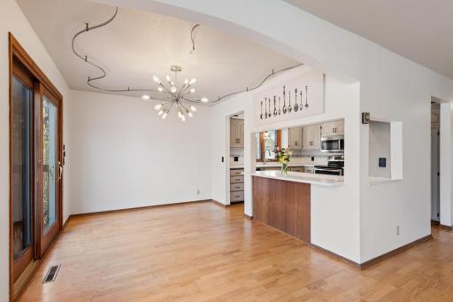 Openings to the kitchen keep area light and bright.