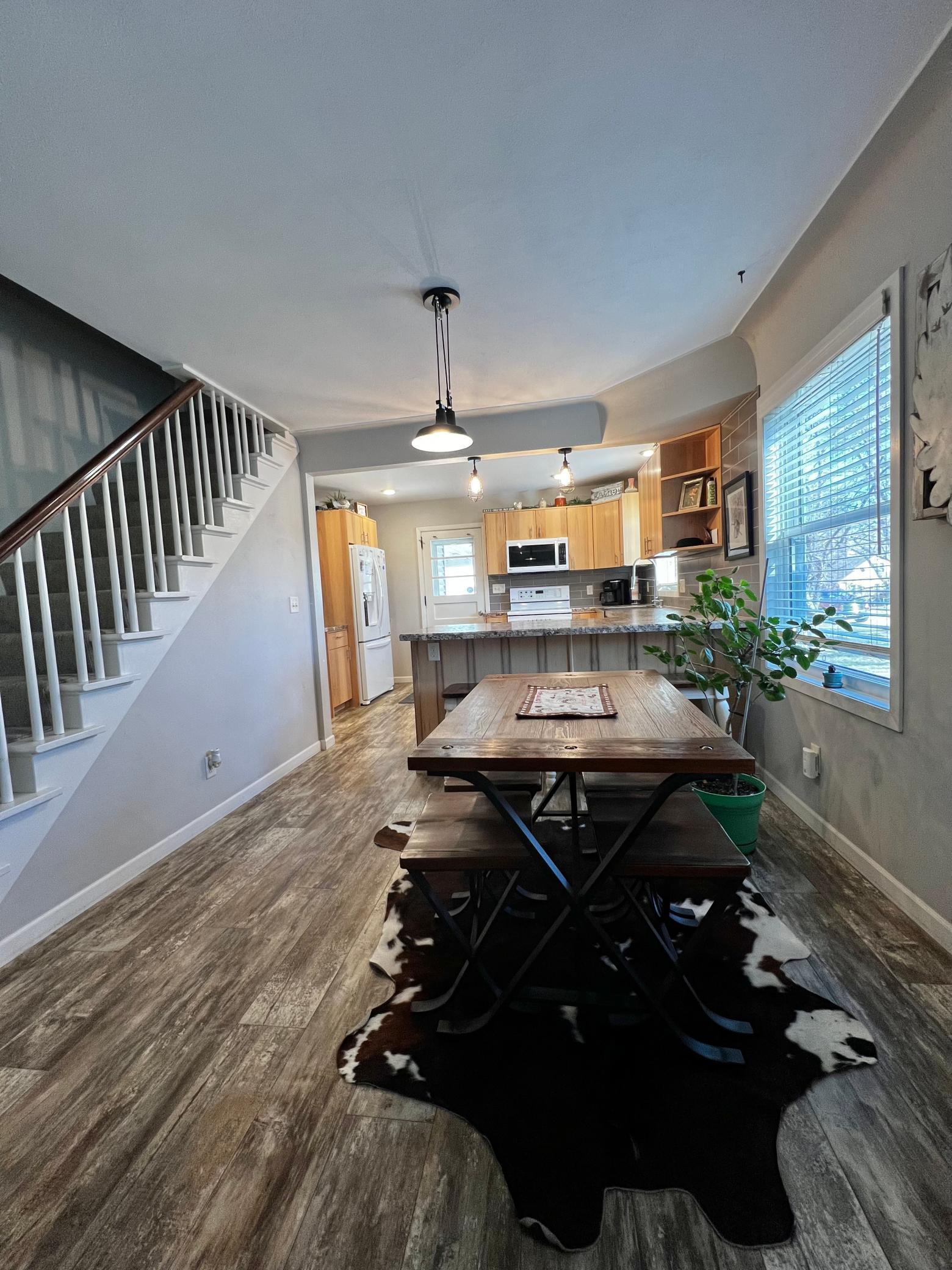 Open Staircase, Dining Room and Kitchen.