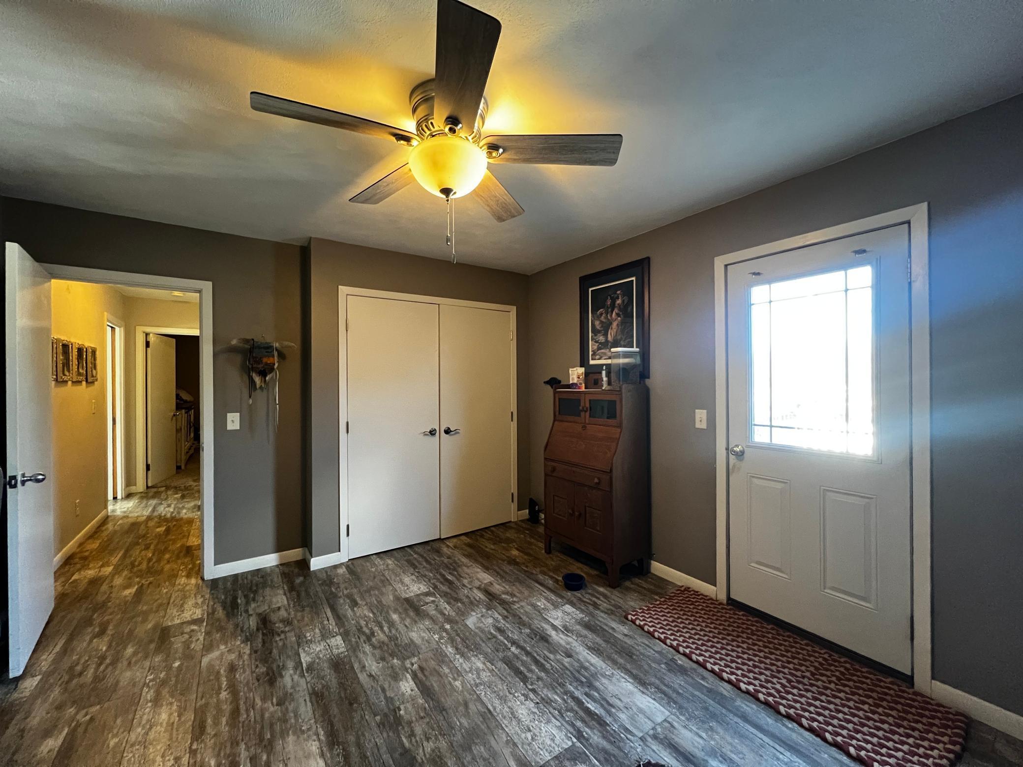 Main Floor Bonus Room with Laundry Closet, Door to Deck and Backyard