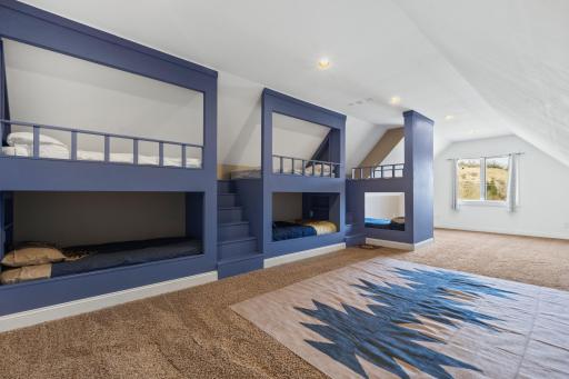 large living room with built in bunk beds.