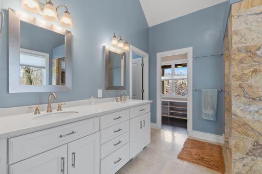 Primary suite bath. Has tub, walk in shower and walk in closet.