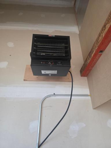 Heater in garage stall.
