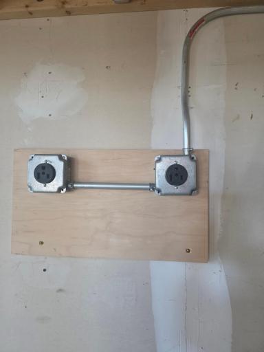 220 VAC Electric in garage for charging electric vehicles or other toys.