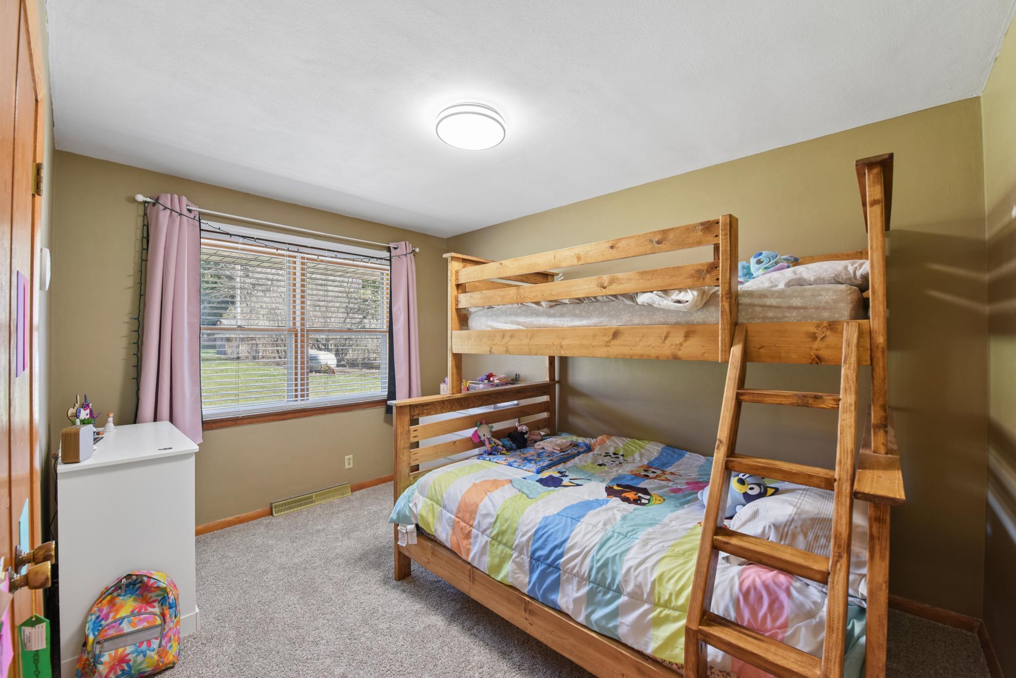 Bedroom 2, overlooking the private backyard.