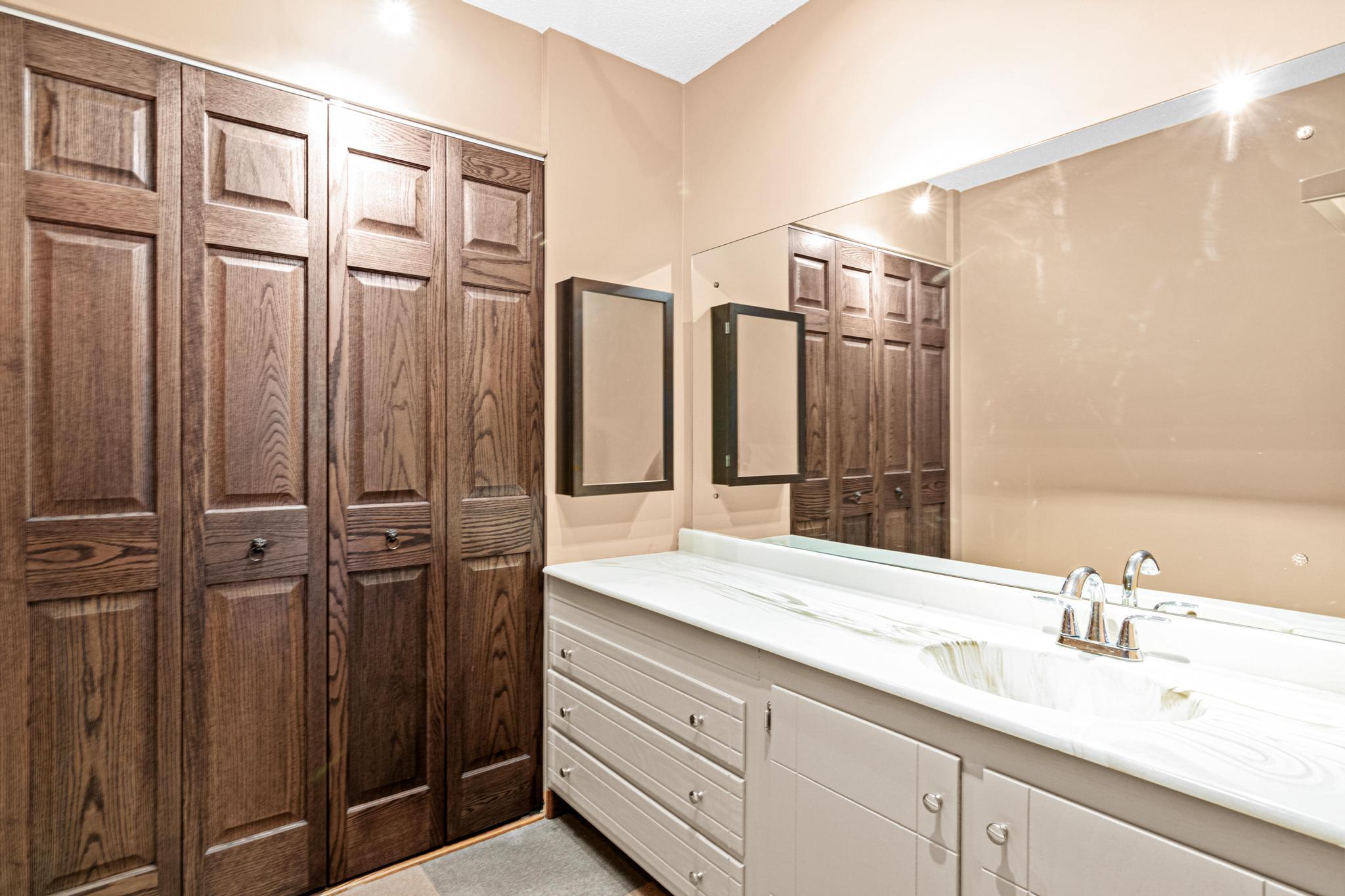 Primary suite vanity and extra deep closet!