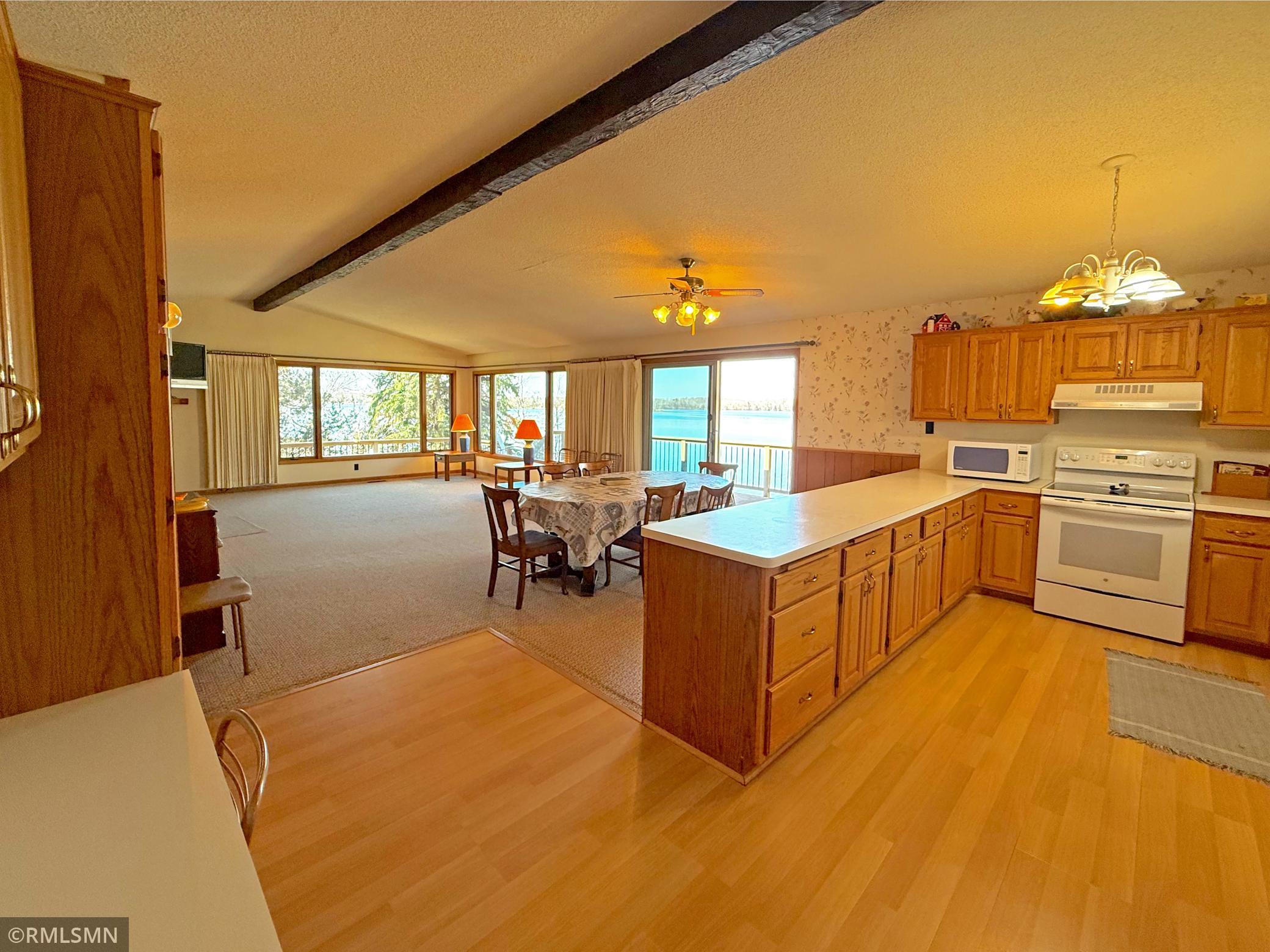 The main living area offers a spacious, vaulted open-concept layout designed to take full advantage of the stunning lake views.
