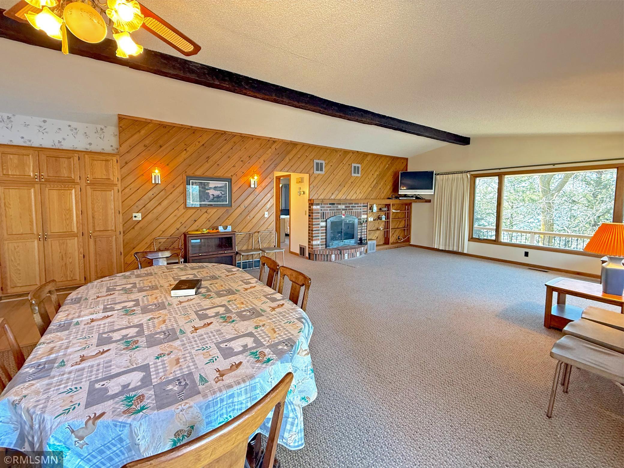 The living room flows effortlessly into the dining area and kitchen, making it ideal for both everyday living and entertaining.