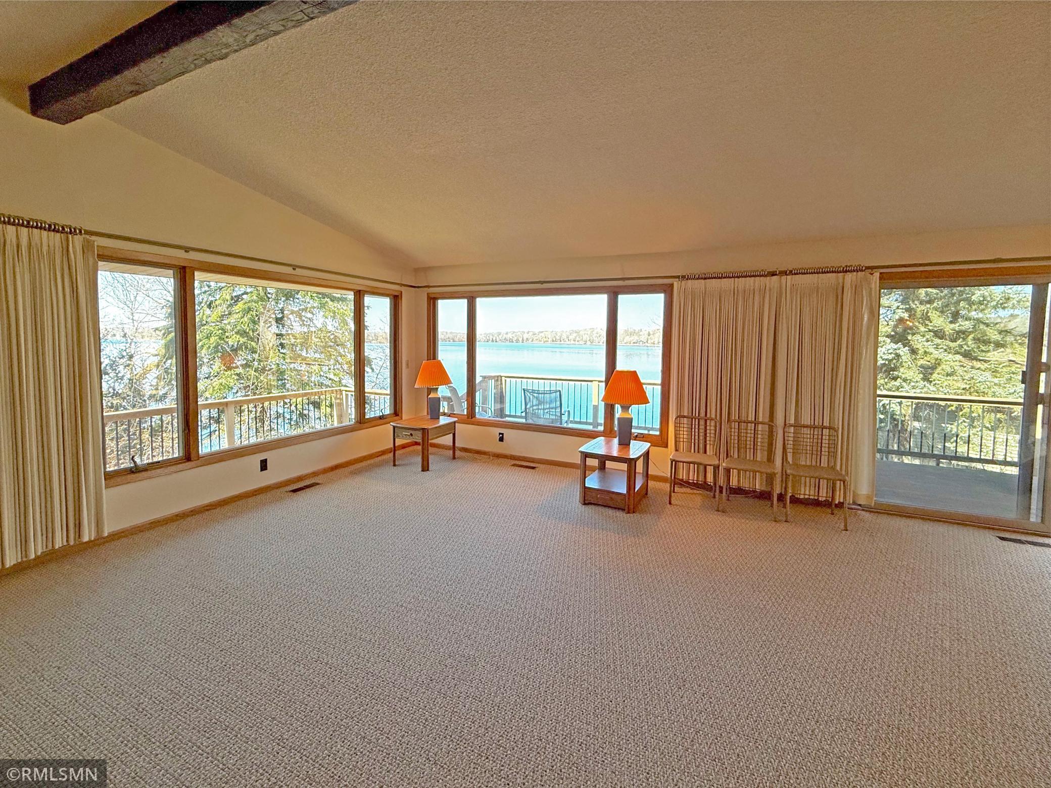 A sliding door leads directly out to the lakeside deck, extending your living space and making indoor-outdoor entertaining a breeze.
