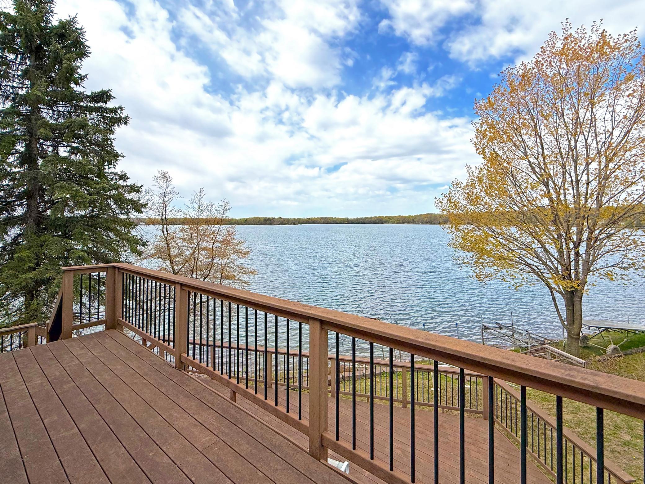 Surrounded by mature trees, the setting offers a perfect blend of privacy and panoramic beauty, creating a true up-north feel.