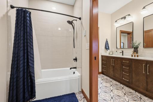 kohler cast iron tub with classic subway tile shower