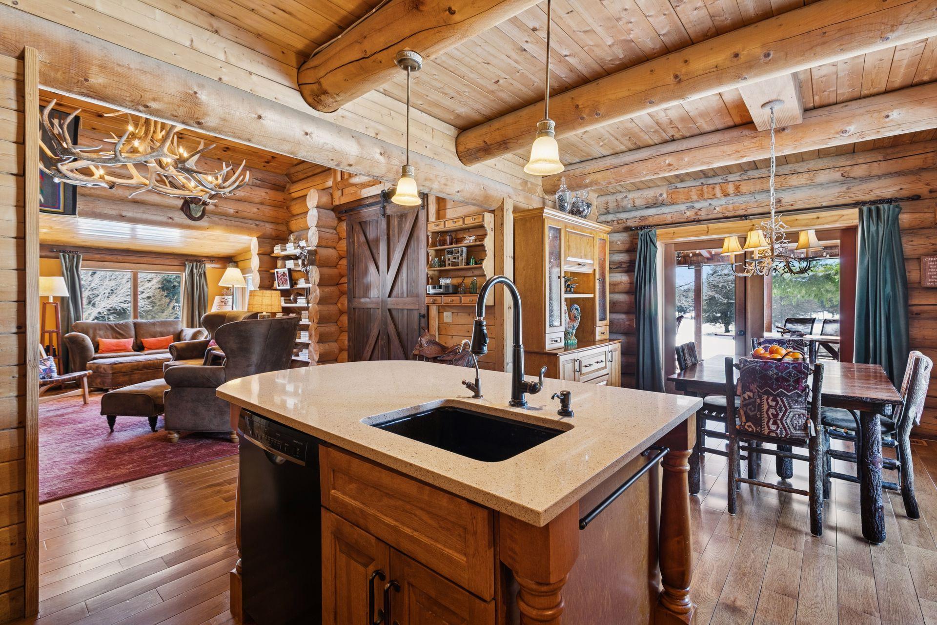 The kitchen showcases beautiful stone countertops and an open-concept layout, creating a seamless flow that’s perfect for both everyday living and entertaining.