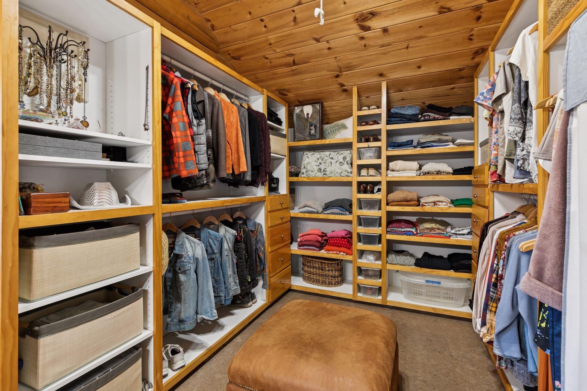 The primary bedroom boasts a spacious and well-organized 15×11 walk-in closet, providing ample storage and effortless organization.