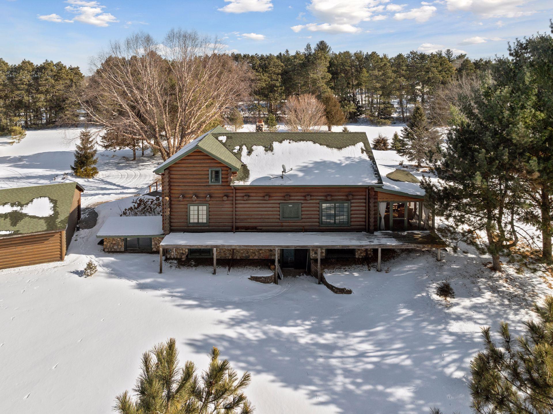 The rear of the home features a spacious deck and walk-out basement, seamlessly connecting indoor living with outdoor enjoyment.
