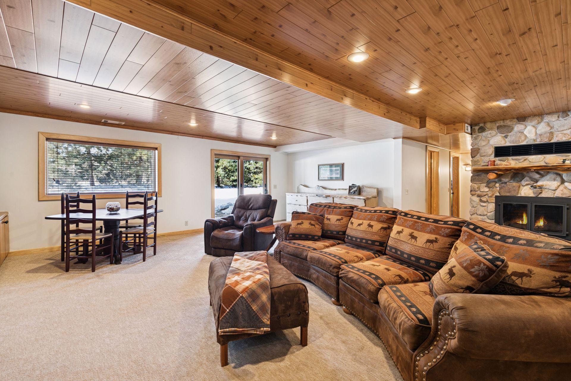 The lower level boasts a spacious 28×23 family room with walk-out basement doors, providing plenty of room for gatherings and seamless access to the outdoors.