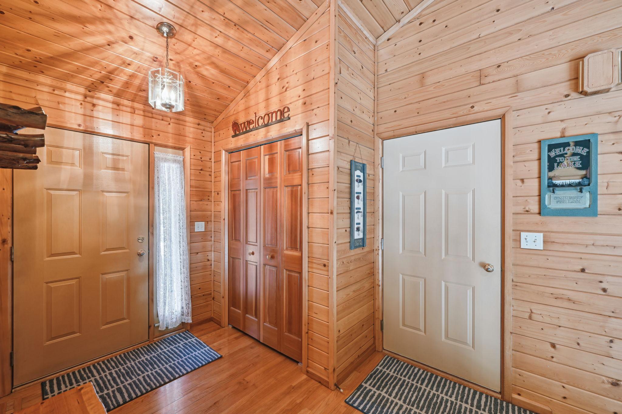 View of the entryway with a large closet. From here there are doors leading to the attached garage as well as to the bonus space above the garage.