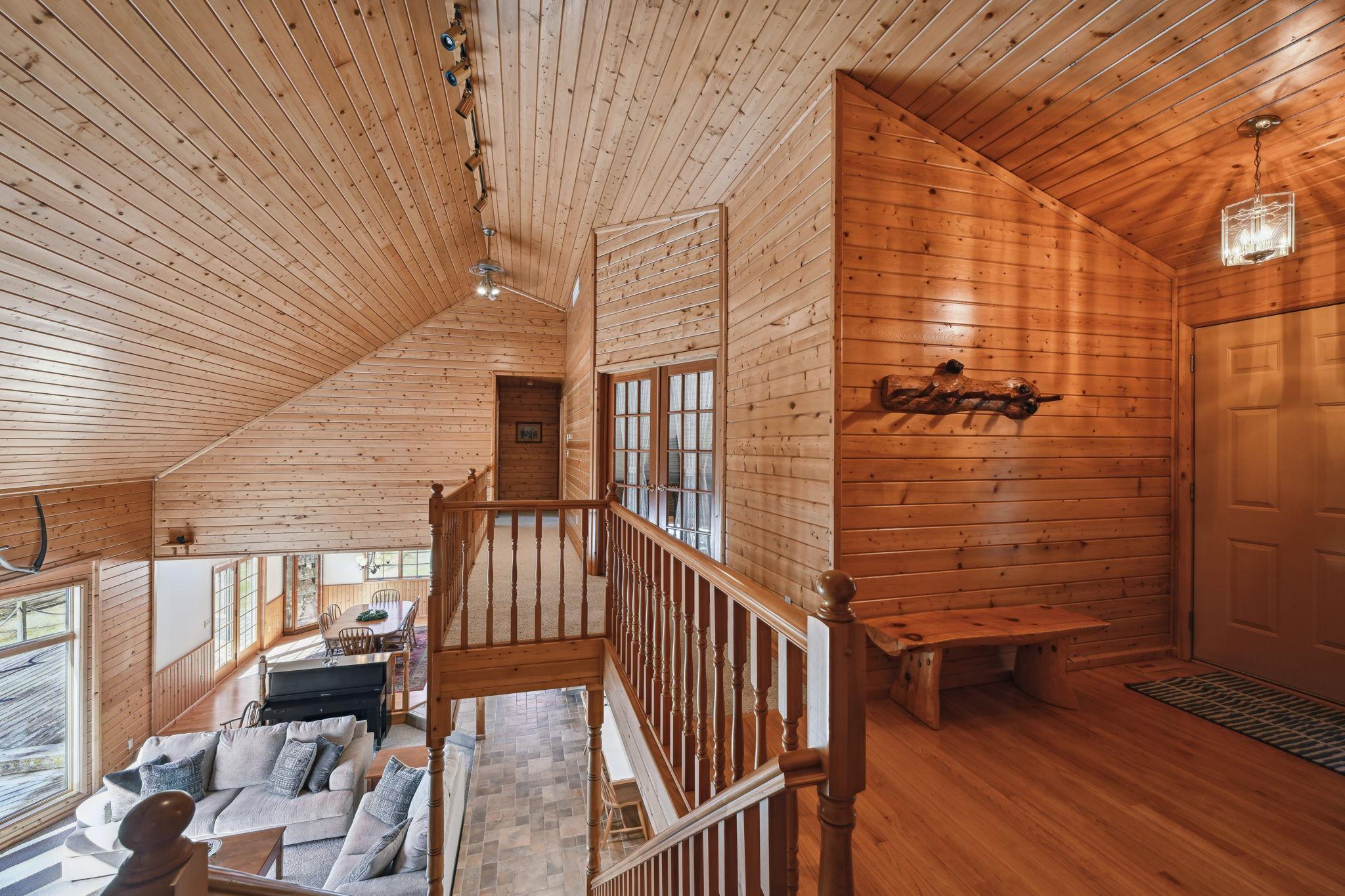 View from the entryway looking over the living room. This home is ready for you to move in and start enjoying all the lake has to offer! Lake Marie is connected to Lake Louisa offering 337+ acres of full recreation fun on the water!