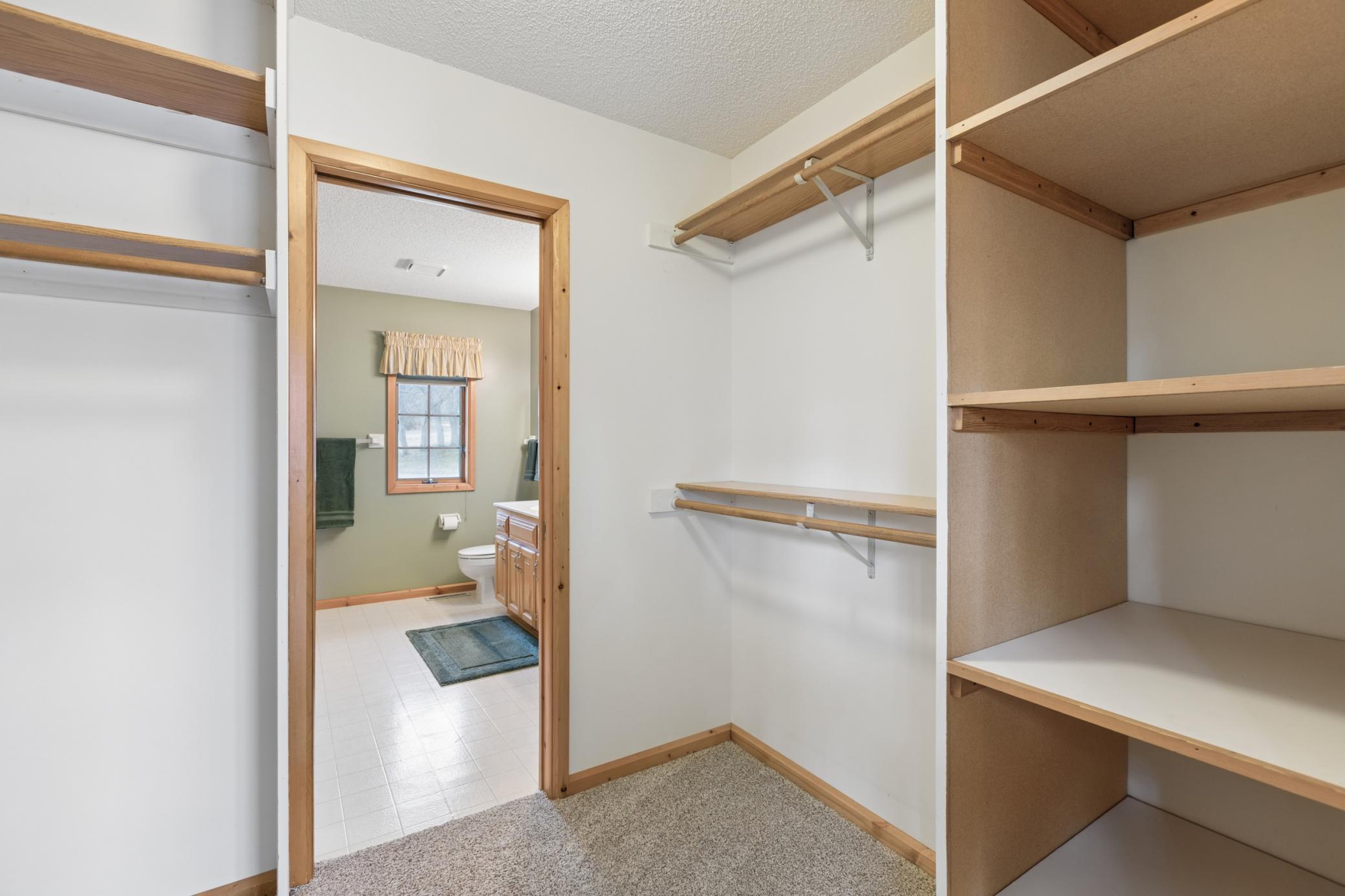 The walk-through closet offers plenty of storage space for all four seasons of clothing.