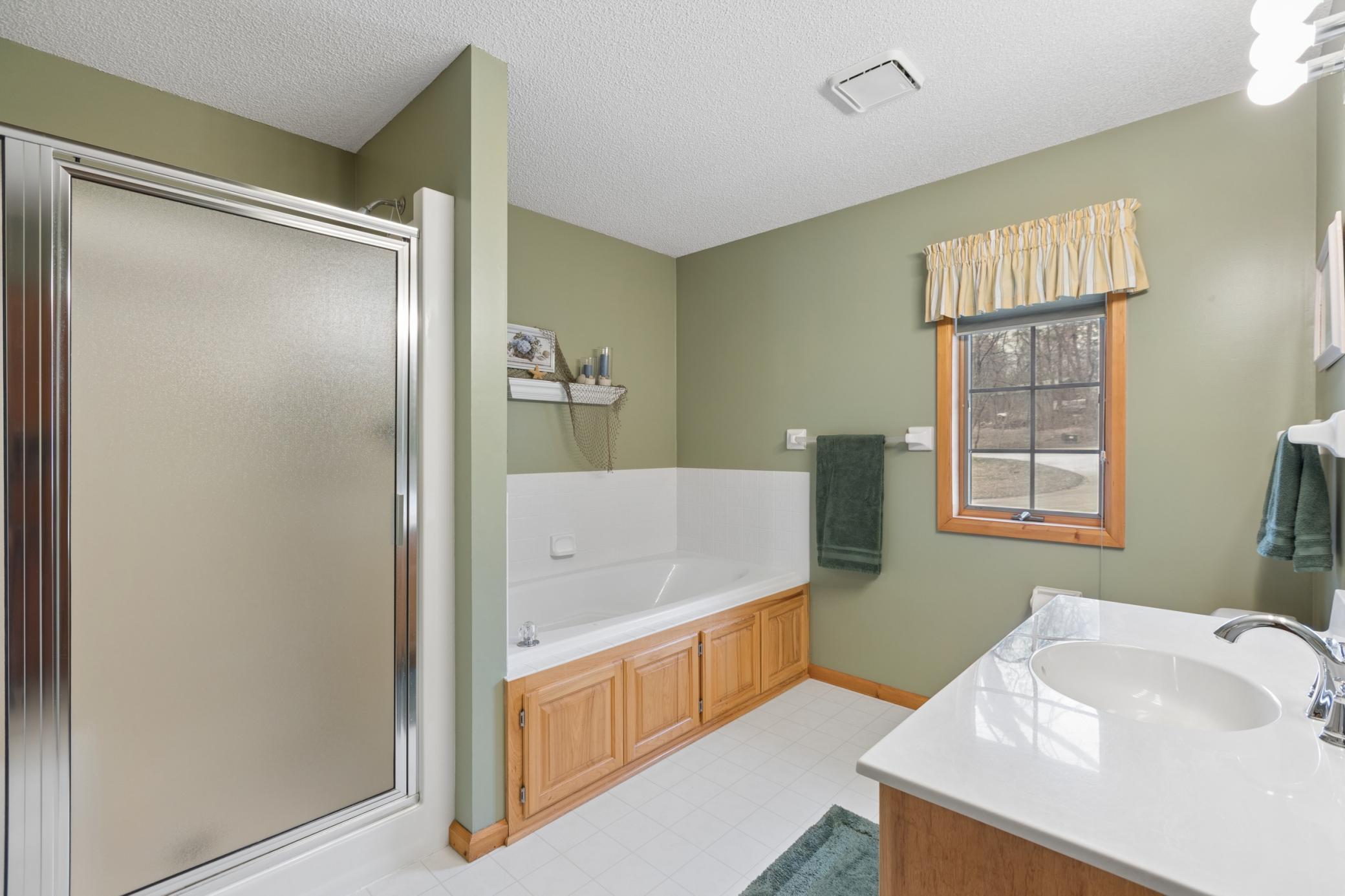 You will love relaxing in the jetted jacuzzi tub and appreciate the separate walk-in shower.