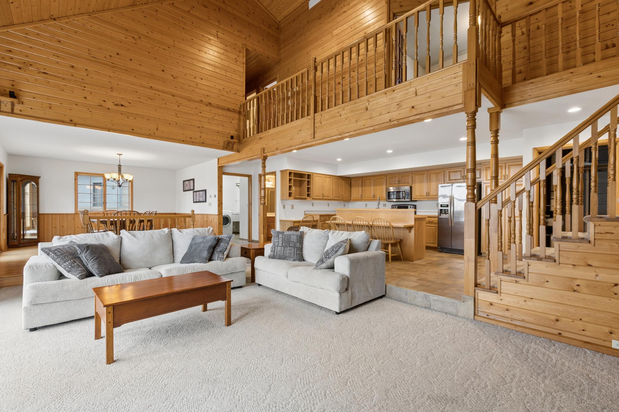 The open design of this custom-built home offers a space for everyone to gather together with phenomenal views out to the lake from throughout this level.