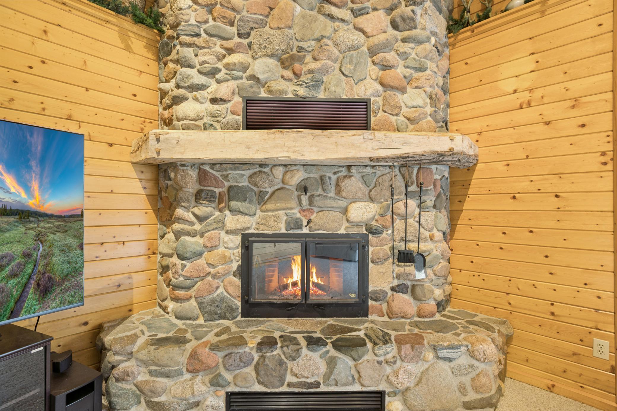 The wood burning fireplace will provide a great ambiance on a chilly day as you relax overlooking Lake Marie.
