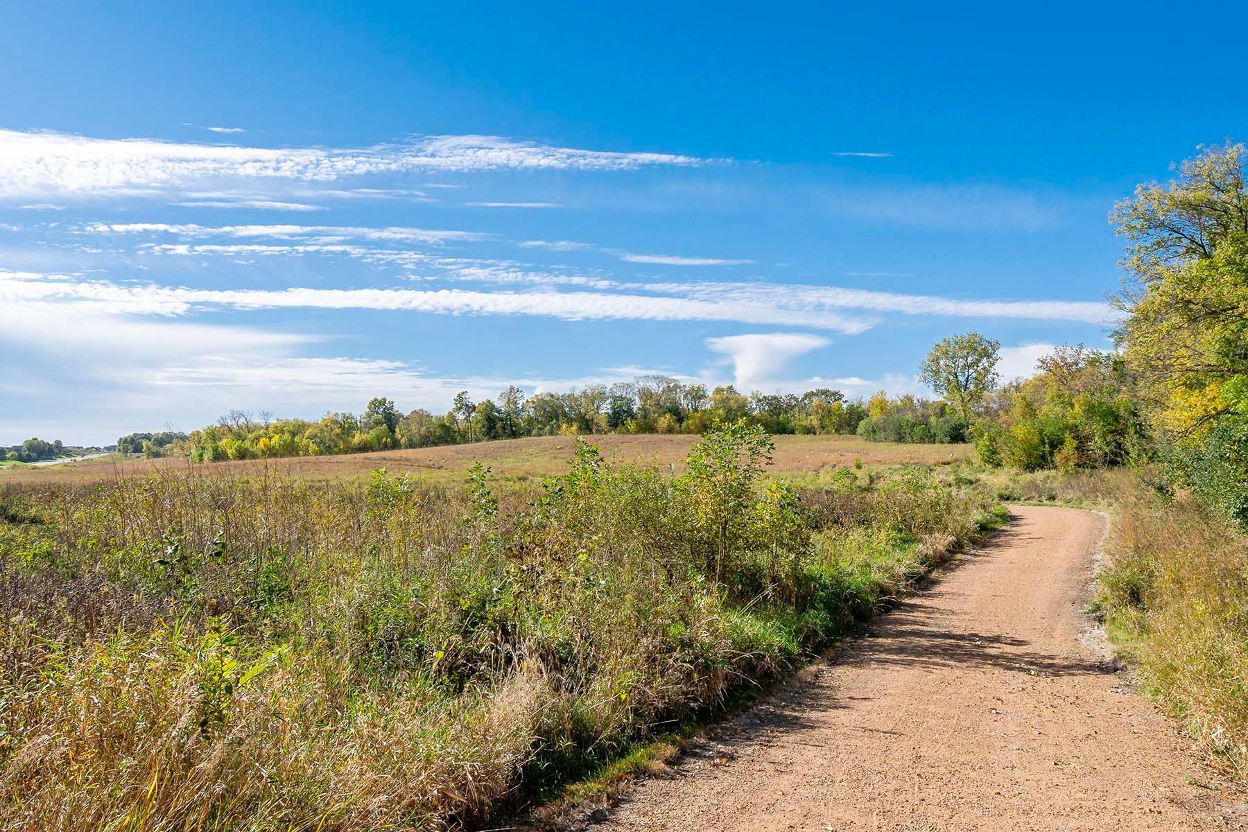 Residents of Wild Meadows enjoy miles of private walking paths that wind through over 200 acres of protected green space, offering a peaceful connection to nature and thoughtfully designed community gathering areas.