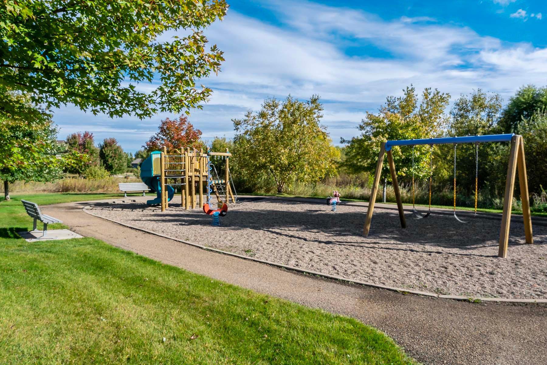 The neighborhood offers three beautifully maintained playgrounds and a charming pergola on the community grounds, creating inviting spaces for families, neighbors, and outdoor enjoyment.