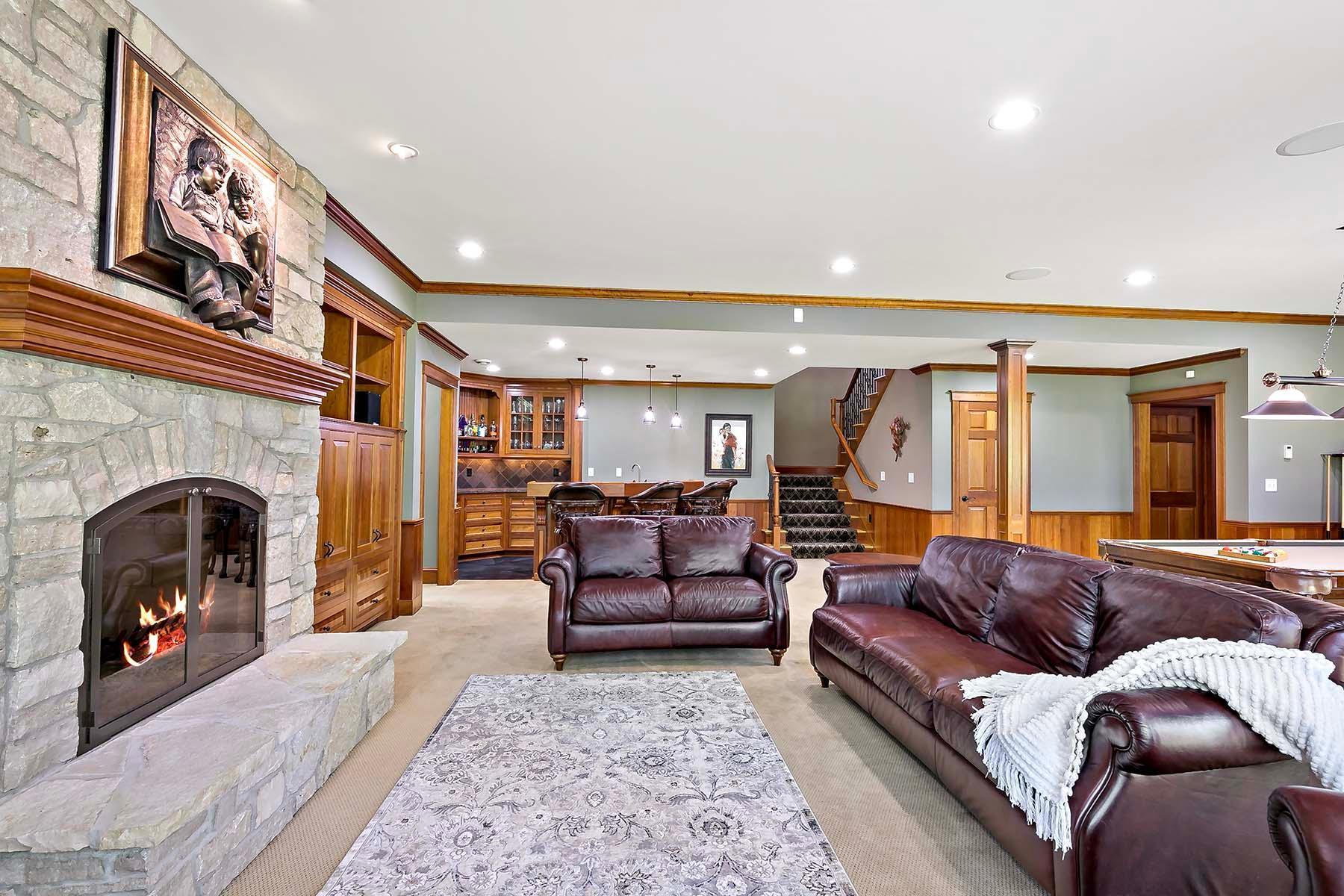 Lower level family room with stone fireplace