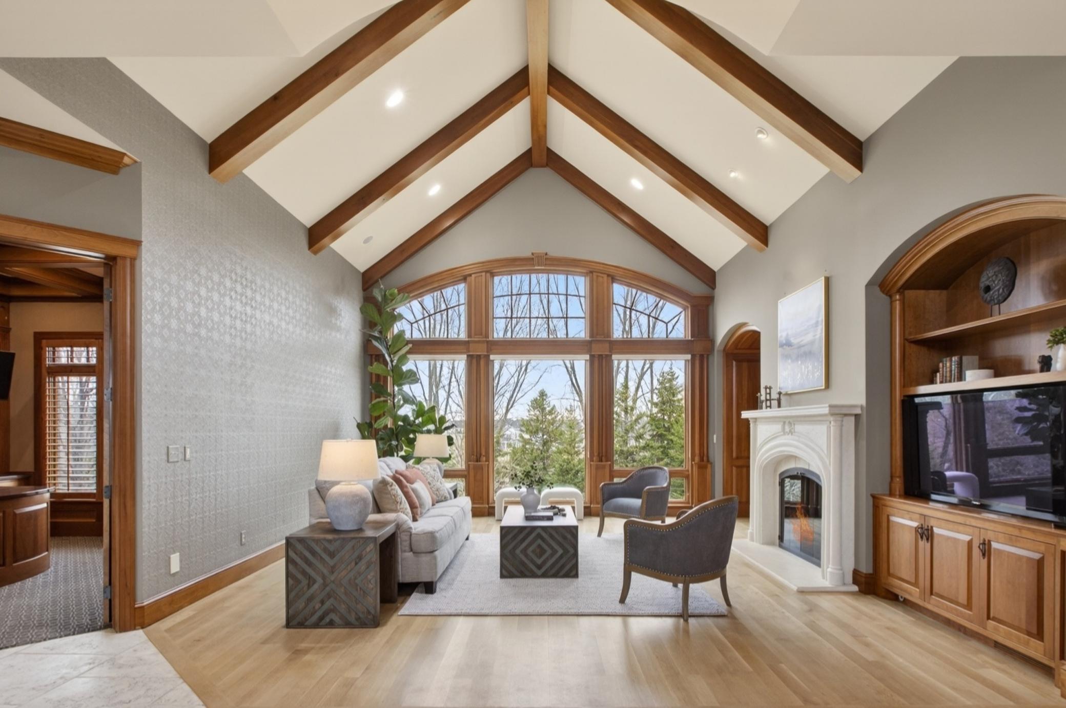Grand entrance with vaulted beam ceiling and new hardwood flooring