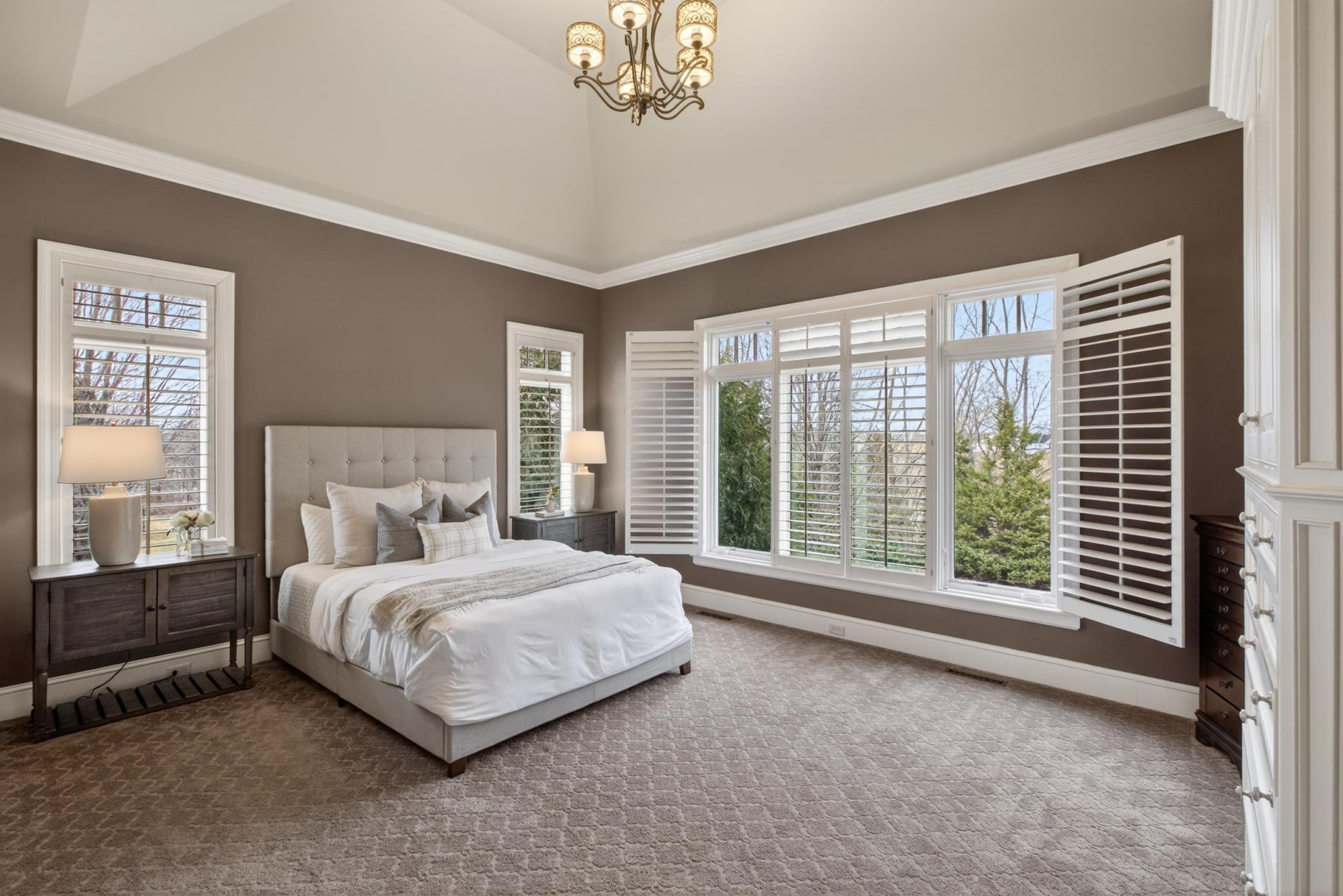 Large primary bedroom on main level with custom built-ins