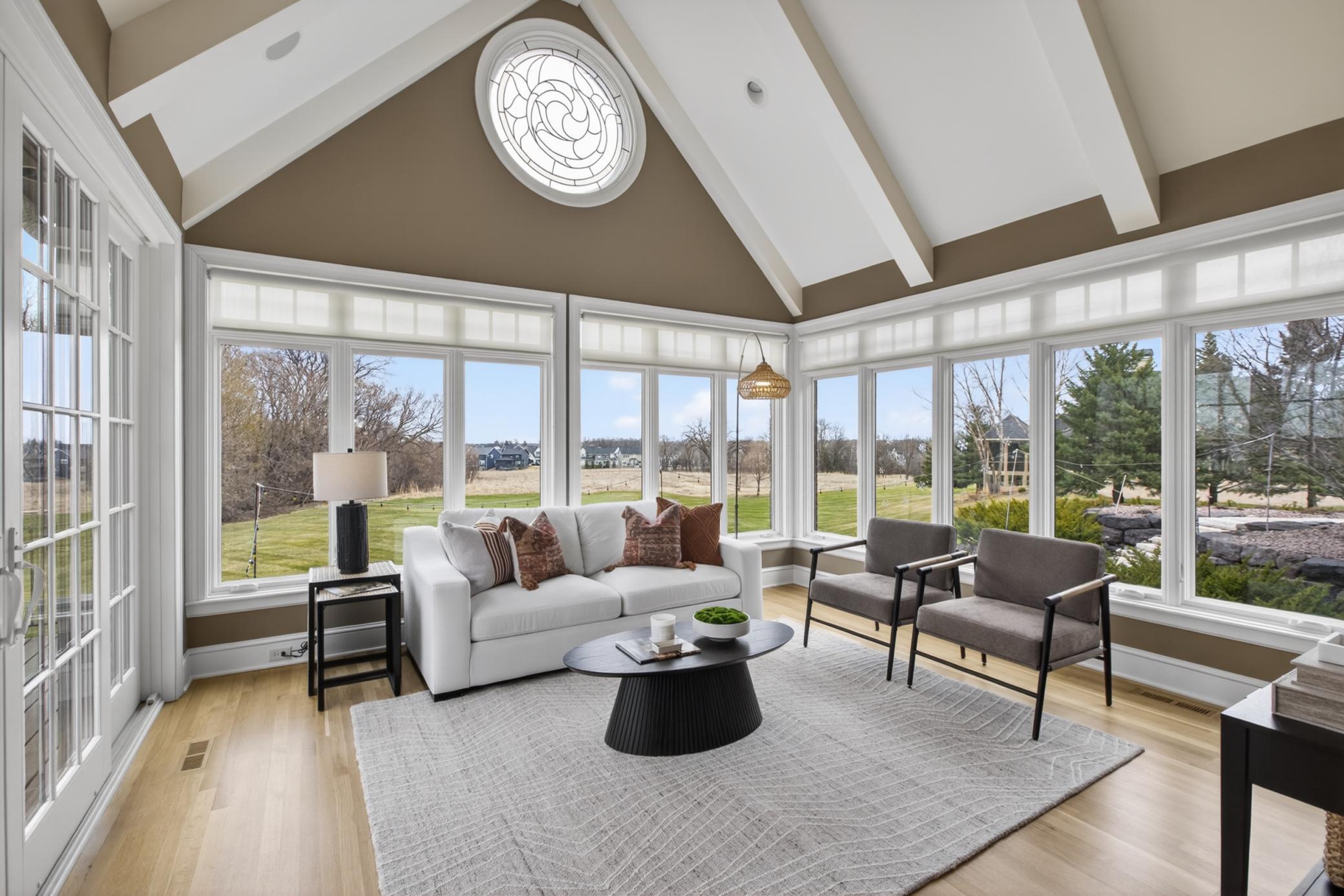 Tons of natural light in main level sunroom