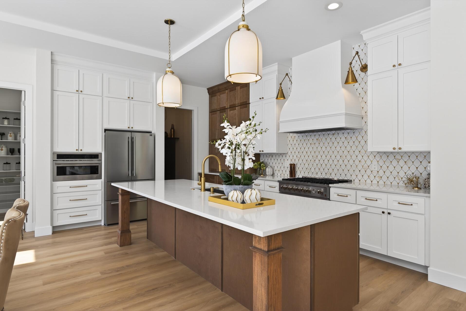 Striking main-floor kitchen with quartz countertops and a marble mosaic backsplash