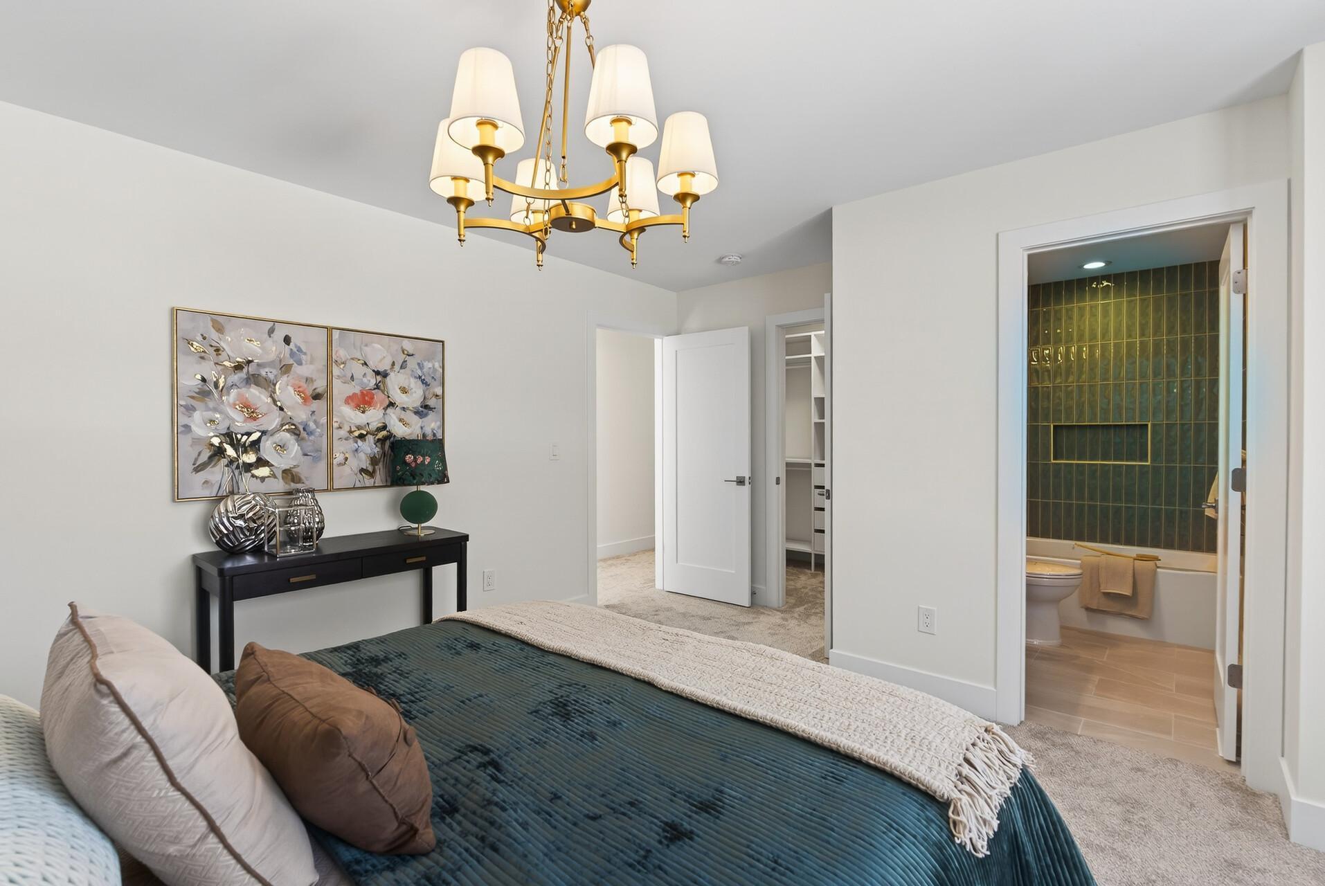 Bedroom 2—Secondary Suite with a private bathroom and walk-in closet