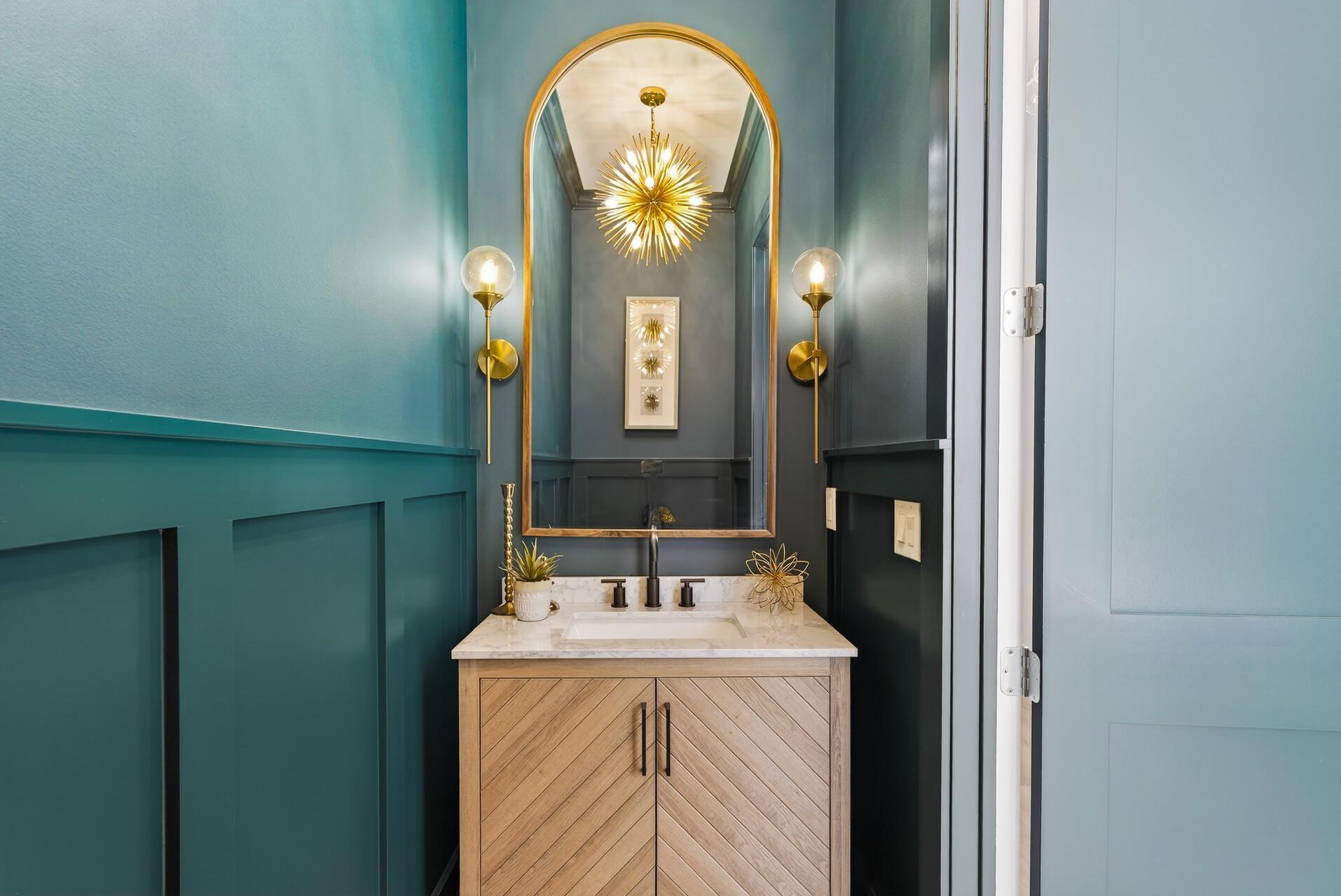 Striking powder room with elegant, moody design - sure to impress your guests