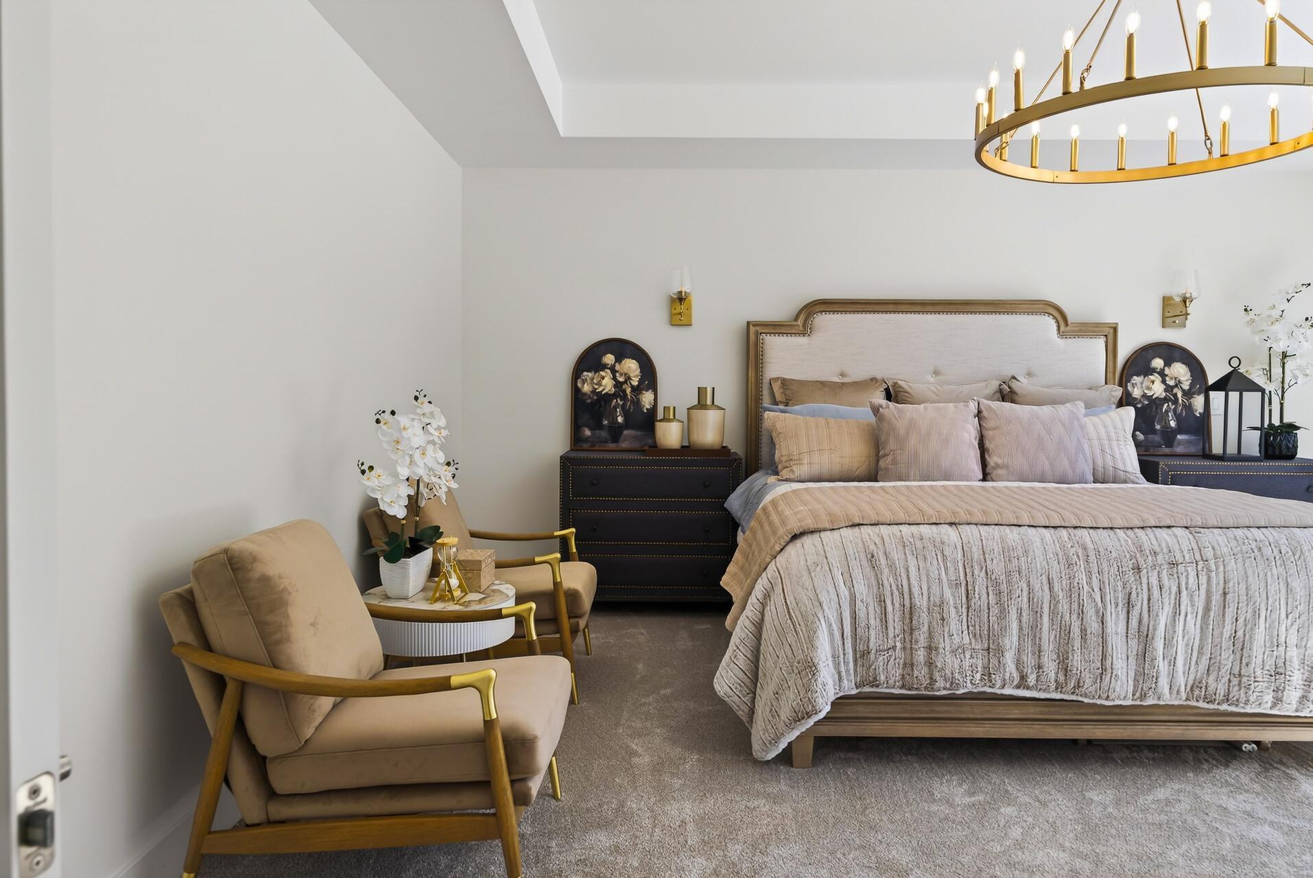 Primary suite with oversized windows offering stunning year-round views and lots of natural light