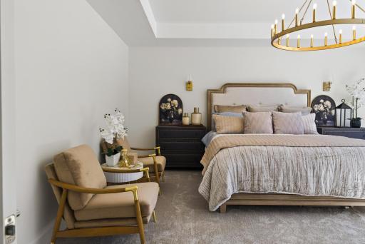 Primary suite with oversized windows offering stunning year-round views and lots of natural light