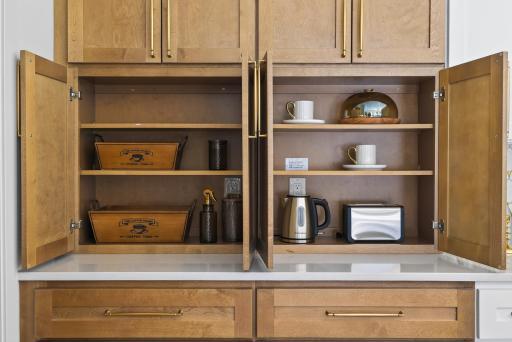 Appliance garage with outlets inside the cabinetry—perfect for keeping small appliances neatly out of sight