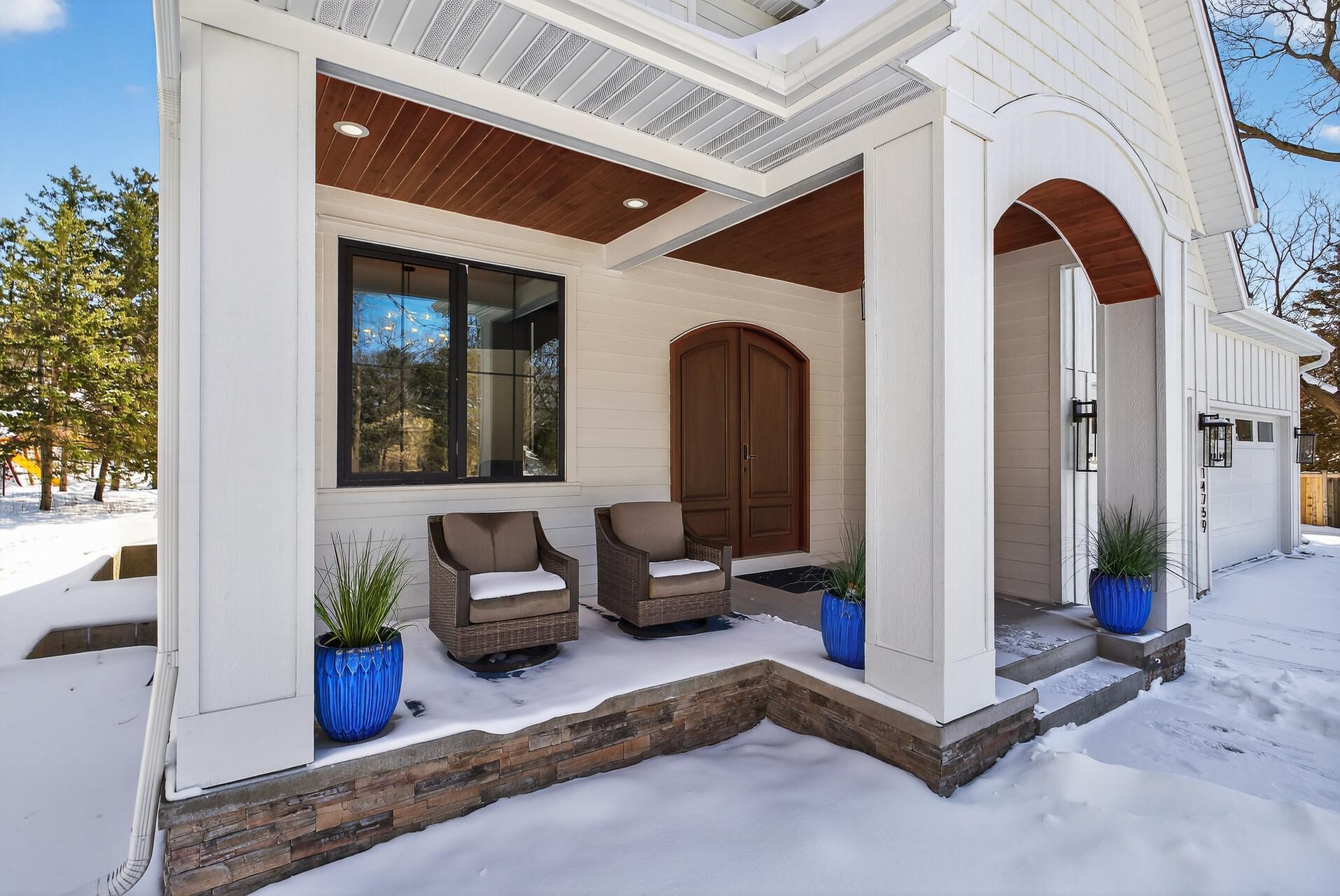 Oversized front porch with custom wood ceiling