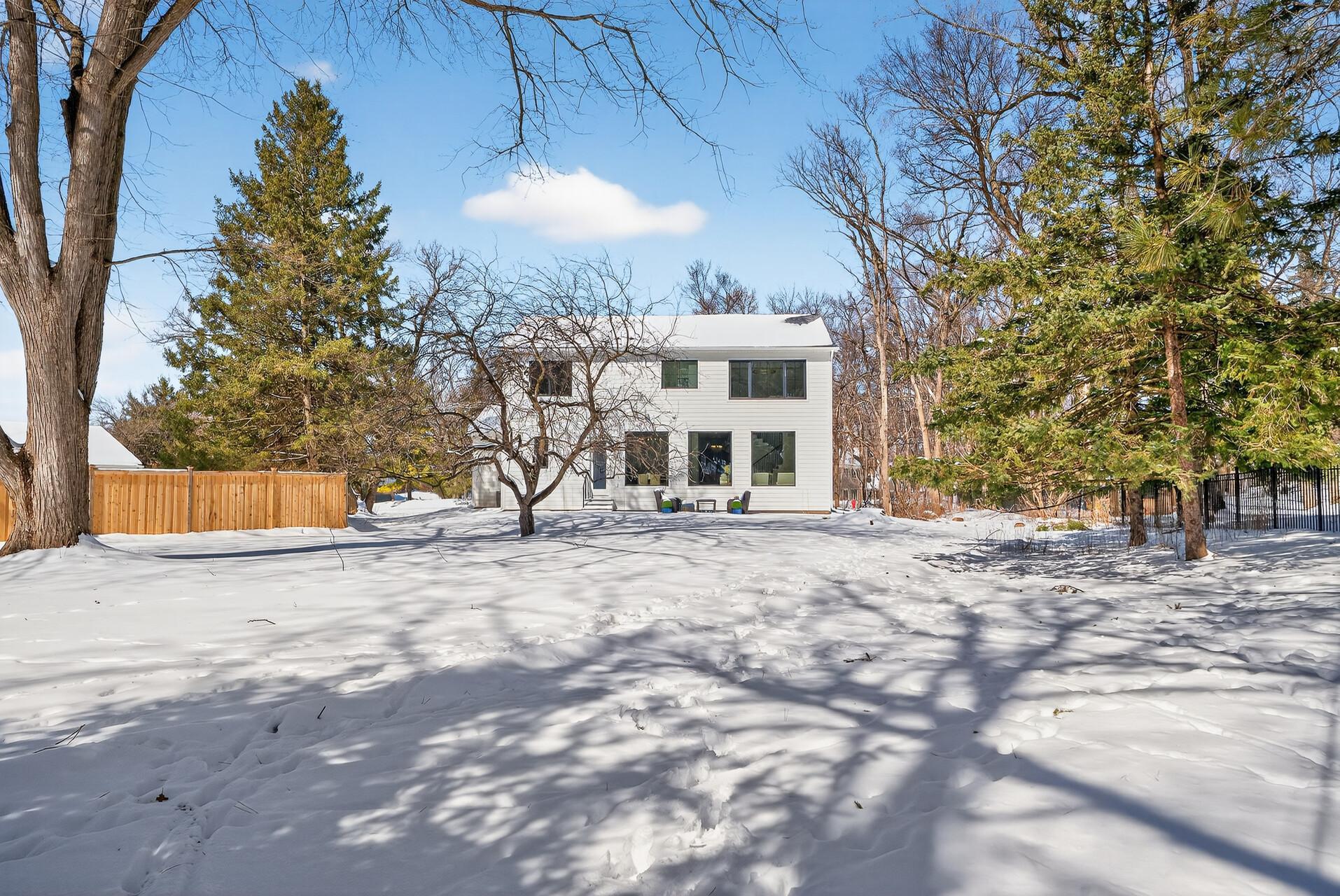 Beautiful, rare, flat half-acre lot with mature trees