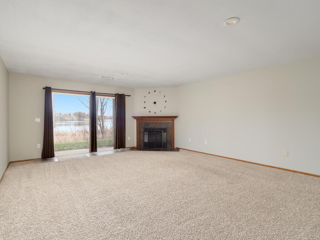 Huge Lower Family room with walkout and wood burning fireplace